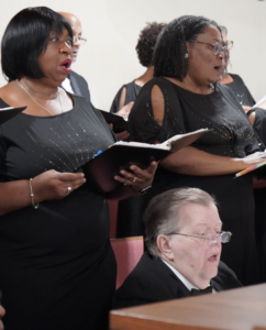 Members of the Gulf Coast Community Choir singing.