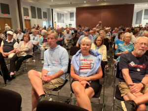 A crowd at a packed conference hall.