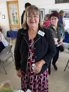 Beth Mayberry smiling in a crowd at an event.