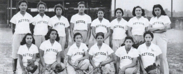 Black and white photo of a baseball team wearing jerseys that read "Azteca".