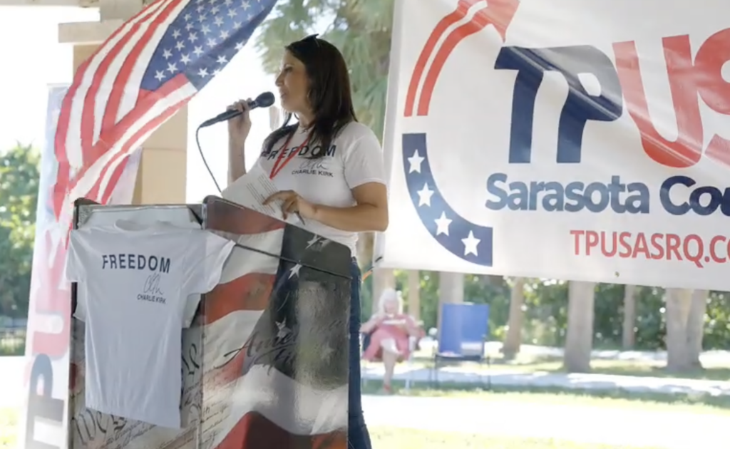 Michelle Pozzie speaking at a Turning Points USA event.