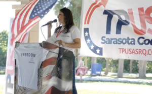 Michelle Pozzie speaking at a Turning Points USA event.
