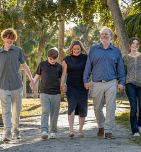 Megan Tennimon with her spouse and three children.