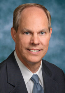 Bill Woeltjen smiling.