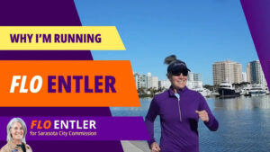 Photo of Flo Entler running with the downtown Sarasota skyline behind her. Text on the side reads "Why I'm Running", "Flo Entler", and "Flo Entler for Sarasota City Commission".