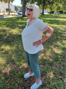 Joan Farrell smiling and posing confidently.
