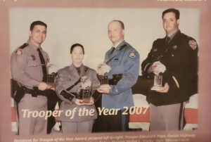 Faded photo of Eddie Pope being awarded Trooper of the Year 2007.