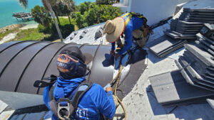 Longboat Key Roofing employees work on a roof.