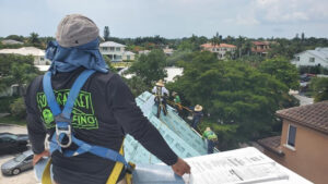Longboat Key Roofing employees work on a roof.