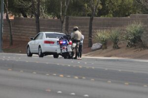 A police officer performing a traffic stop.
