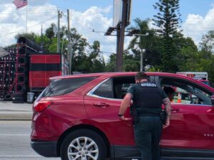A police officer performing a traffic stop.