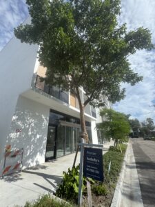 Street view of a high-end contemporary condo building.