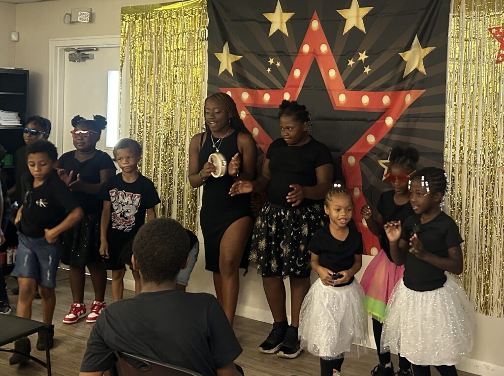 Students perform for an audience.