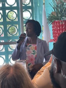 Angie Nixon speaking into a mic.