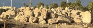 A massive pile of rocks along the shore.