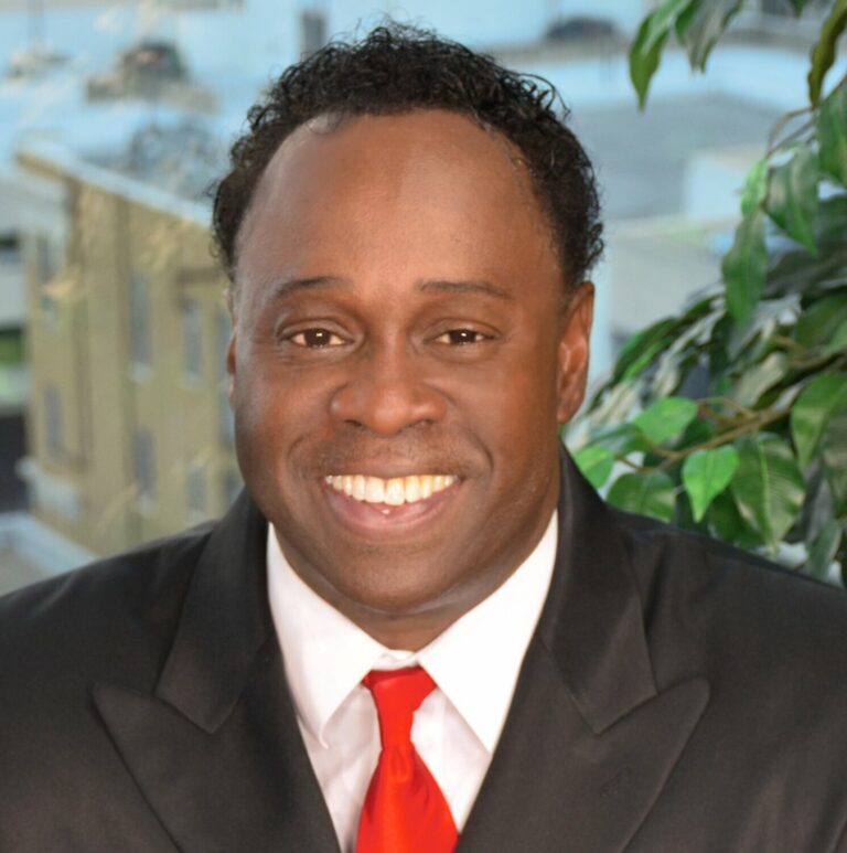 Charles Smith smiling.