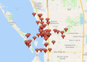 A map of the Sarasota area with dozens of red markers indicating parks.