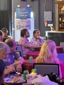 Audience members at Fogartyville. Hanging signs deliver pro-union messaging.