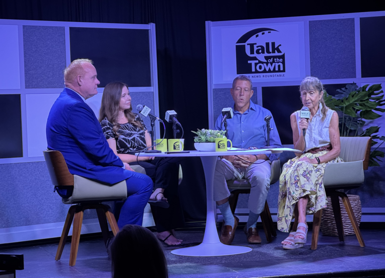 Martin Hyde, Holly Bullard, George Kruse and Carrie Seidman around a table with Talk of the Town branding behind them.