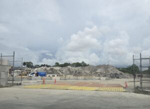 A large pile of concrete dust outside a crushing plant.