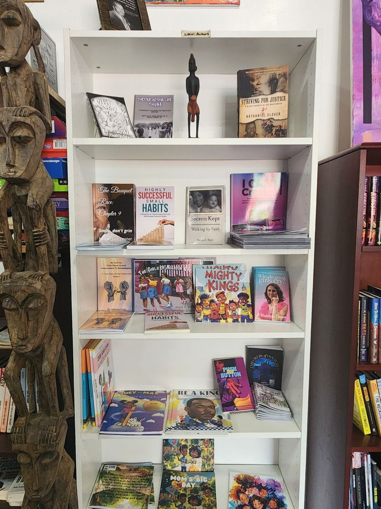 Books including "Highly Successful Small Habits," "Secrets Kept: Walking By Faith," "Mighty Kings, "Why Do Good Girls Cry?" and "Push the Button" on display on a shelf.