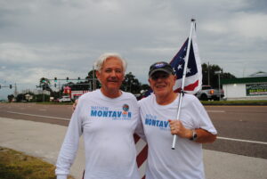Matt Montavon and a supporter who holds a US flag smiling.