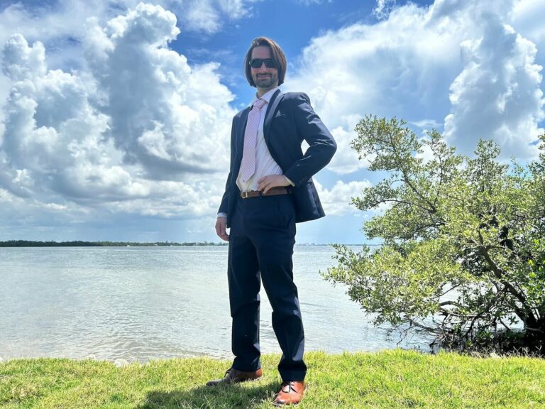 Ocean Fitts standing proudly and smiling.